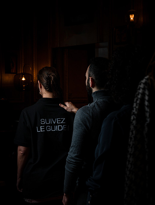 Group celebrating a bachelor party in a line at Dans le Noir ? restaurant